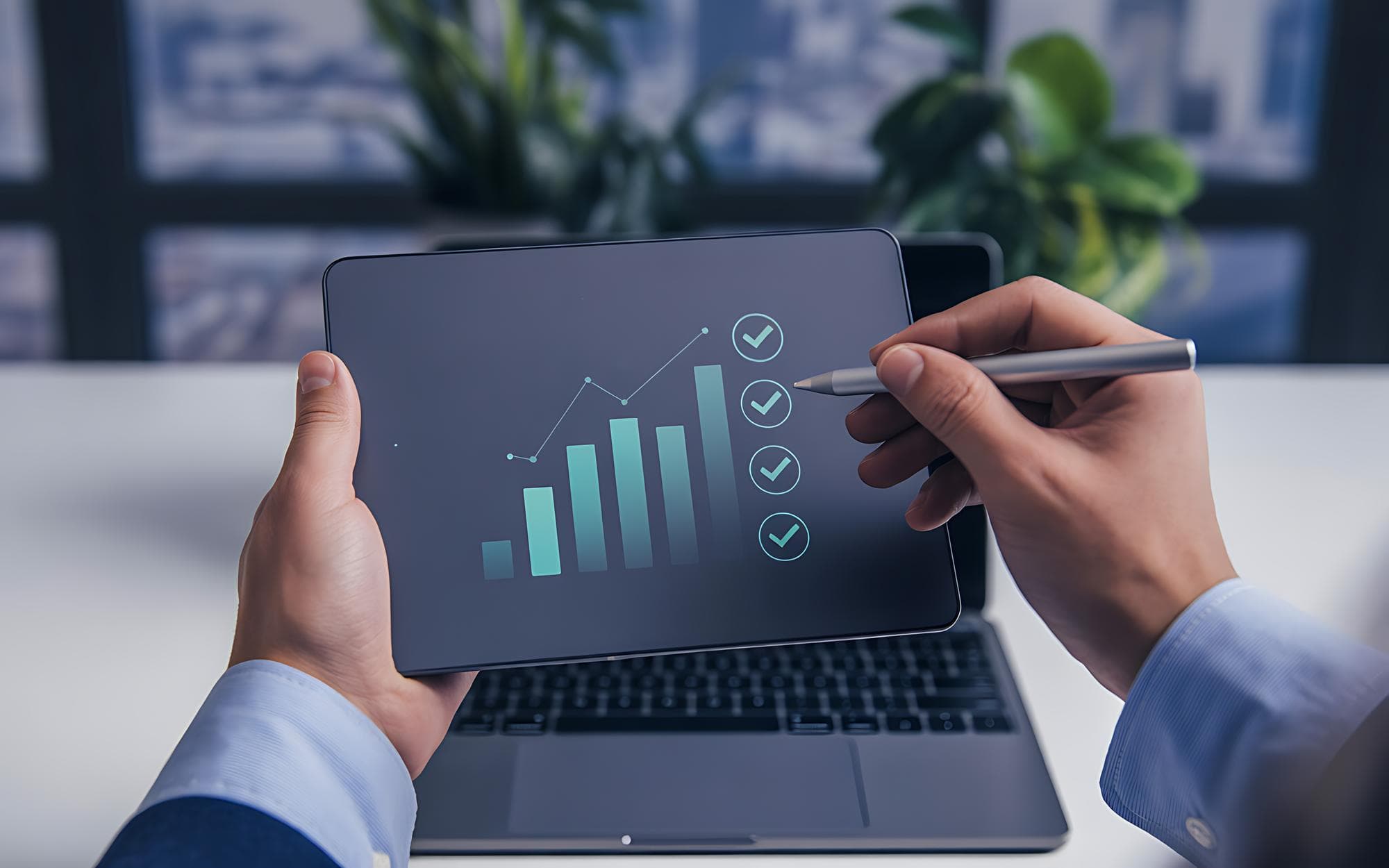Business team reviewing performance metrics on a tablet